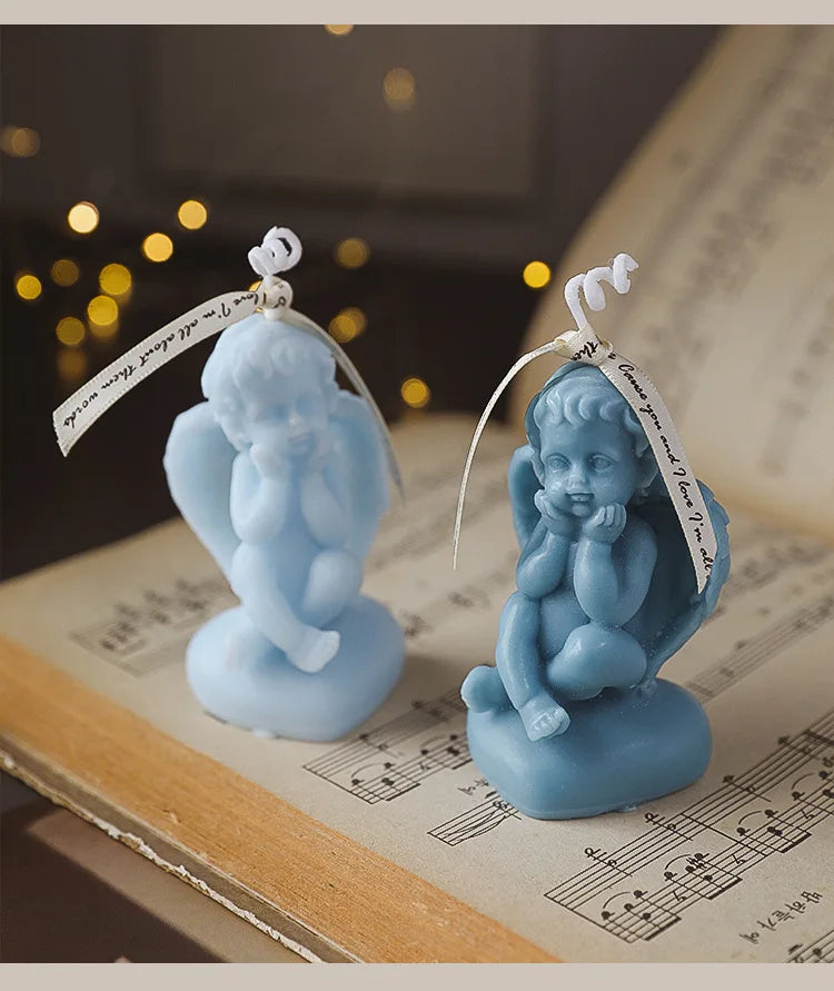 Candela decorativa a forma di angioletto